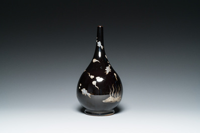 A Chinese black-glazed reverse-decorated bottle vase, 19th C.