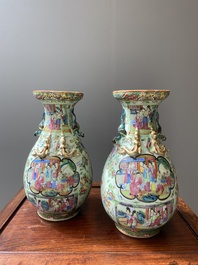 A pair of Chinese Canton famille rose celadon-ground vases, 19th C.