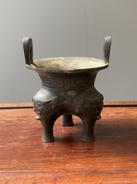A Chinese archaic bronze tripod censer, 'ding', Ming