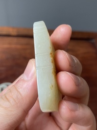 Een Chinese witte en roestkleurige jade hanger en een celadon jade 'vlinder' plaquette, Qing/Republiek