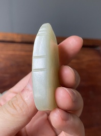 Een Chinese witte en roestkleurige jade hanger en een celadon jade 'vlinder' plaquette, Qing/Republiek