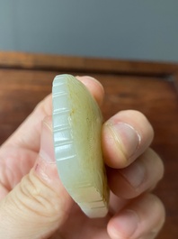 Een Chinese witte en roestkleurige jade hanger en een celadon jade 'vlinder' plaquette, Qing/Republiek