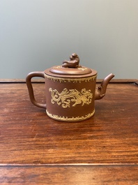 A Chinese Yixing stoneware teapot and cover with an applied dragon, Kangxi