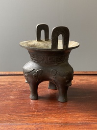A Chinese archaic bronze tripod censer, 'ding', Ming