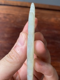 Een Chinese witte en roestkleurige jade hanger en een celadon jade 'vlinder' plaquette, Qing/Republiek