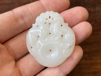A Chinese white jade 'mythical beasts' pendant, Qing