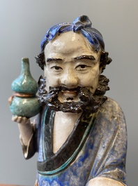 A large Chinese polychrome Shiwan pottery figure of Li Tieguai, 19th C.