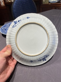 A pair of Chinese blue and white plates with the arms of the De Pinto family for the Portuguese market, Kangxi