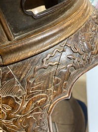 A Chinese wood circular incense stand with mythic animals, 'xiangji', Ming