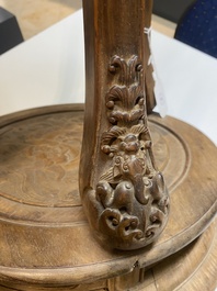 A Chinese wood circular incense stand with mythic animals, 'xiangji', Ming