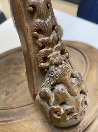 Een Chinese huanghuali houten sokkel voor een wierookbrander met decor van mythische dieren, 'xiangji', Ming