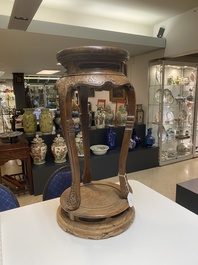 A Chinese wood circular incense stand with mythic animals, 'xiangji', Ming