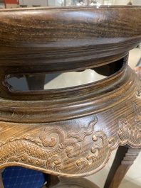 A Chinese wood circular incense stand with mythic animals, 'xiangji', Ming