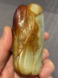 A small Chinese white and russet jade 'cabbage' vase, 19th C.