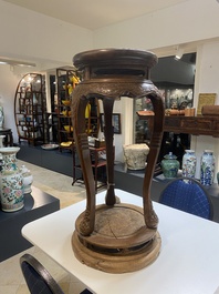 A Chinese wood circular incense stand with mythic animals, 'xiangji', Ming