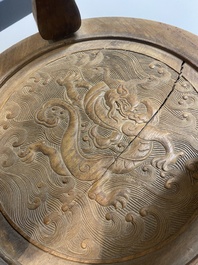 A Chinese wood circular incense stand with mythic animals, 'xiangji', Ming