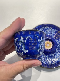 A pair of Chinese Canton enamel trembleuse cups on stands with double 'Shou' design, Qianlong