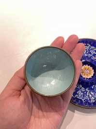 A pair of Chinese Canton enamel trembleuse cups on stands with double 'Shou' design, Qianlong