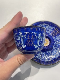 A pair of Chinese Canton enamel trembleuse cups on stands with double 'Shou' design, Qianlong