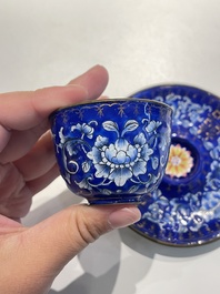 A pair of Chinese Canton enamel trembleuse cups on stands with double 'Shou' design, Qianlong