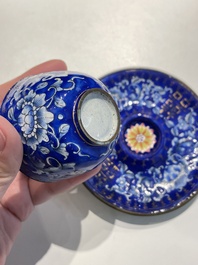 A pair of Chinese Canton enamel trembleuse cups on stands with double 'Shou' design, Qianlong