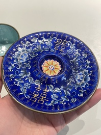 A pair of Chinese Canton enamel trembleuse cups on stands with double 'Shou' design, Qianlong