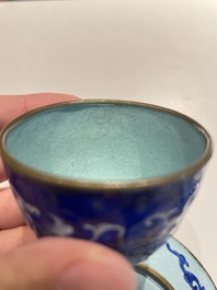 A pair of Chinese Canton enamel trembleuse cups on stands with double 'Shou' design, Qianlong