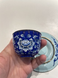 A pair of Chinese Canton enamel trembleuse cups on stands with double 'Shou' design, Qianlong