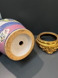 A Chinese famille verte vase and an enamelled Yixing stoneware vase with gilt bronze mounts, 19th C.