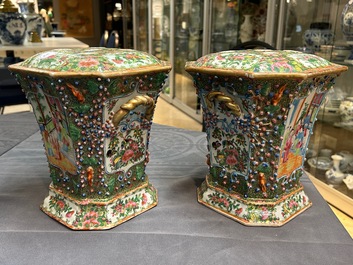 A pair of Chinese Canton famille rose flower holders and covers, 19th C.