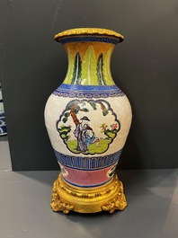 Un vase en porcelaine de Chine famille verte et un en gr&egrave;s de Yixing &eacute;maill&eacute; aux montures en bronze dor&eacute;, 19&egrave;me