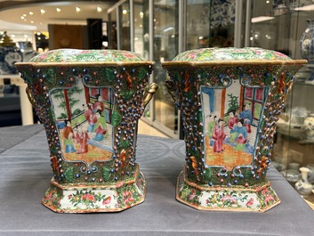 A pair of Chinese Canton famille rose flower holders and covers, 19th C.