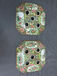 A pair of Chinese Canton famille rose flower holders and covers, 19th C.