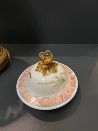 A Chinese famille verte vase and an enamelled Yixing stoneware vase with gilt bronze mounts, 19th C.