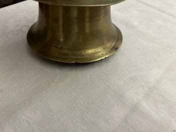 A Flemish brass capstan candlestick, 16th C.