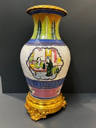 Un vase en porcelaine de Chine famille verte et un en gr&egrave;s de Yixing &eacute;maill&eacute; aux montures en bronze dor&eacute;, 19&egrave;me