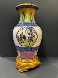 Un vase en porcelaine de Chine famille verte et un en gr&egrave;s de Yixing &eacute;maill&eacute; aux montures en bronze dor&eacute;, 19&egrave;me