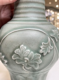 A Chinese Longquan celadon 'peony scroll' vase, Yuan
