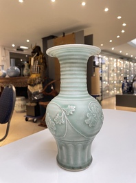 A Chinese Longquan celadon 'peony scroll' vase, Yuan