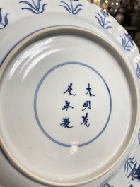 Three Chinese blue and white 'Mongolian hunt' dishes, Chenghua mark, Kangxi