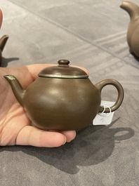 Two Chinese Yixing stoneware teapots and covers with brass mounts, one with Yigong 逸公 seal mark, 19/20th C.