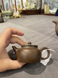 Two Chinese Yixing stoneware teapots and covers with brass mounts, one with Yigong 逸公 seal mark, 19/20th C.