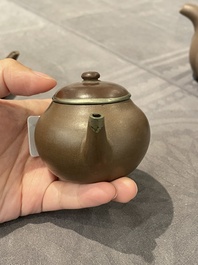 Two Chinese Yixing stoneware teapots and covers with brass mounts, one with Yigong 逸公 seal mark, 19/20th C.