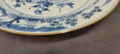 A pair of Chinese blue and white dishes with raised central medallions, Kangxi