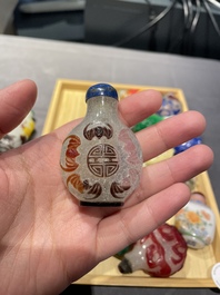A varied collection of Chinese snuff bottles in glass, hardstone and jade, 19/20th C.