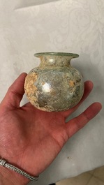 Two Roman glass balsamariums, a flask and a bowl, 2nd/4th C.