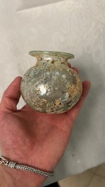 Two Roman glass balsamariums, a flask and a bowl, 2nd/4th C.