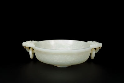An important Chinese chrysanthemum-shaped very pale celadon jade marriage bowl, 18th C.