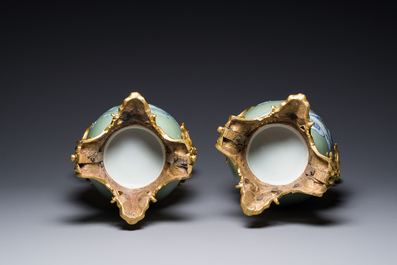 A pair of Chinese blue and white celadon-ground vases with gilt bronze mounts, 19th C.