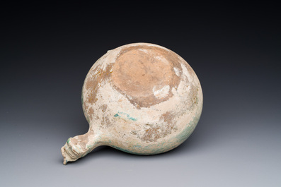 A Chinese monochrome green-glazed pottery scoop, Han